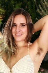 Woman has hairy private parts and she demonstrates them outdoor