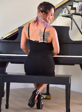 Tattooed hottie with hairy pussy rides stick-on dildo near piano
