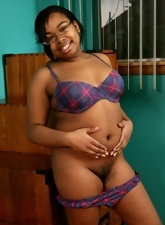 Joyful black mom shows hairy pussy and natural boobs