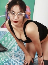Lady with glasses shows hairy Latina pussy under short skirt