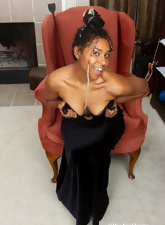 Ebony is very attractive with her black hairy pussy in an evening dress