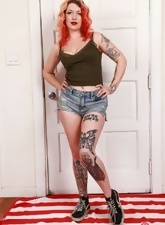 Apricot shows tattoos on her naked body and hairy crotch