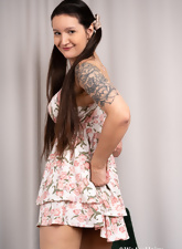 Hairy Tattooed Milf Undressing On Chair Photos