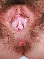 Tatted babe pulls panties down to reveal insanely thick hairy pussy